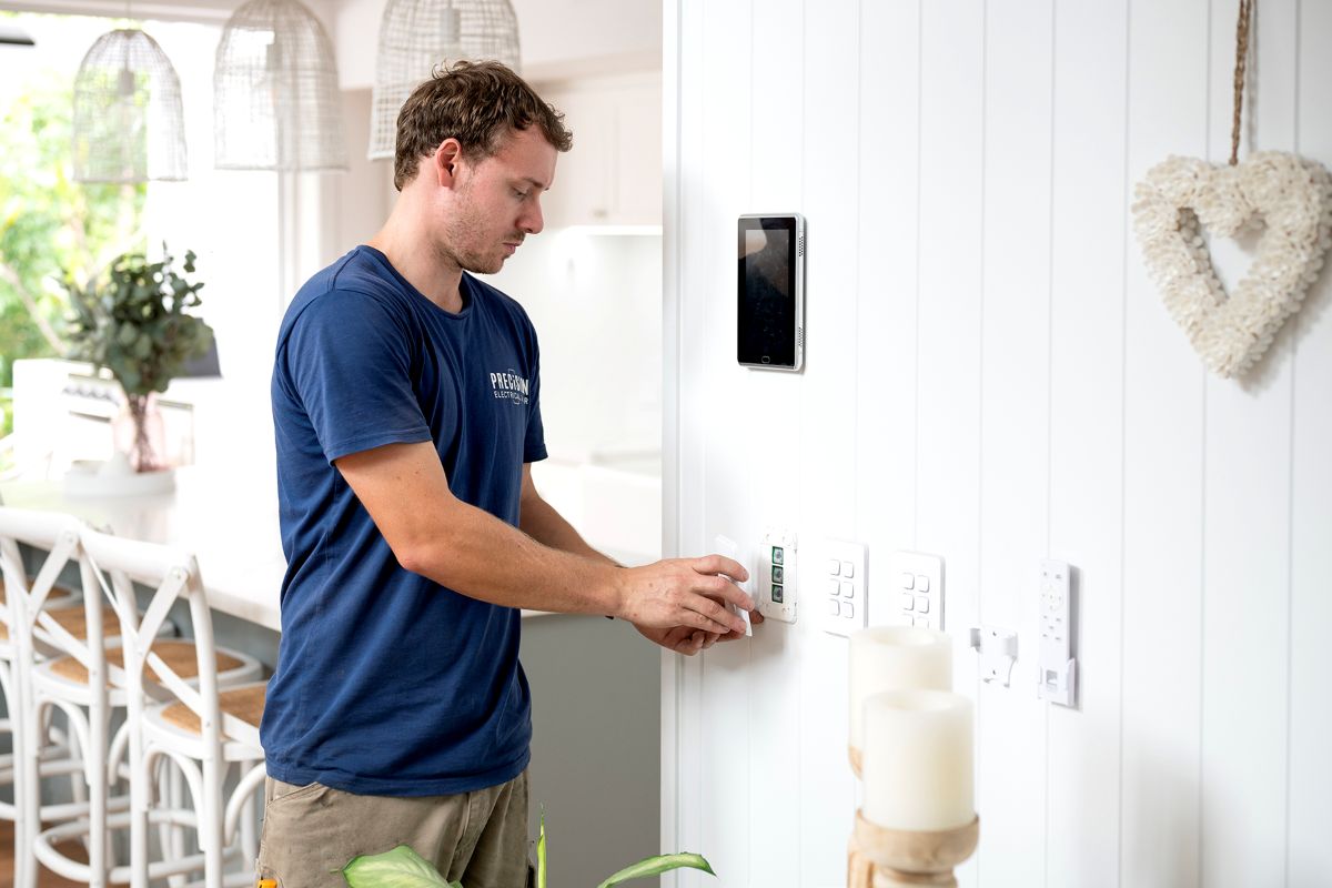 Precision electrician installing a new power point