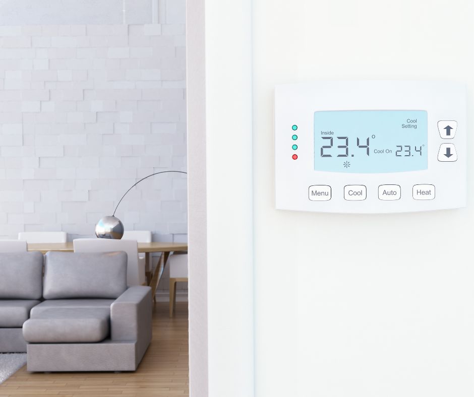 Air conditioning thermostat on a wall