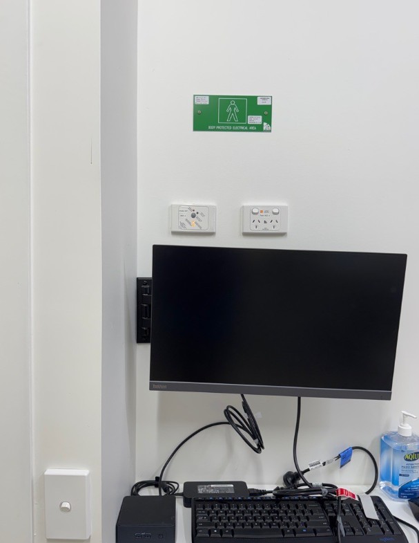 Consult room with data and power outlets for medical equipment
